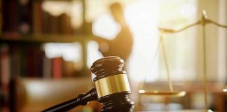 Wealthy DEPRAVED Brothers FINALLY Sentenced Judge's gavel on a desk with scales of justice in background