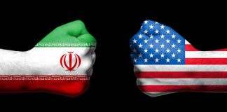 Iran Spy Plot Rattles U.S. Bomber Base Fists painted as Iran and United States flags facing each other