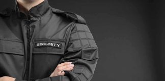 Embassy Guard ATTACKED — What He Did NEXT security guard in black uniform with crossed arms