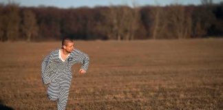 Killer Serving Life Is LOOSE — Where He Hid His Victim man in striped outfit running across a field