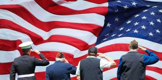 Feds Kept SHIELDING Illegal Immigrant — Then He STRUCK Veterans salute a large American flag