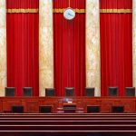 Supreme Court Showdown With TRUMP Smack In The MIDDLE Supreme court courtroom with red curtains and empty judges' bench