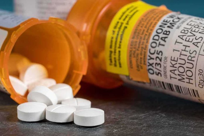 shutterstock_1360335023-1 white pills spilling from prescription bottles