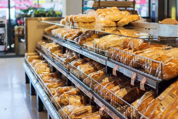 shutterstock_1456130279 Bakery shelves with packaged loaves of bread