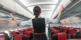 United Jet Turns Back — Crew CAUGHT Him MIDAIR Flight attendant checks overhead bins in empty airplane cabin