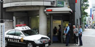 What Hotel CAMERAS Caught Put U.S. Marine In JAIL Japanese police box with patrol car and officers speaking to two men