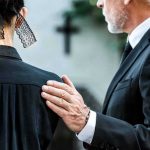 Judge HUGGED Grieving Parents — And Spoke Of His OWN Son Man in suit comforting a woman in black at a funeral