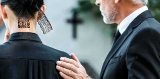 Judge HUGGED Grieving Parents — And Spoke Of His OWN Son Man in suit comforting a woman in black at a funeral