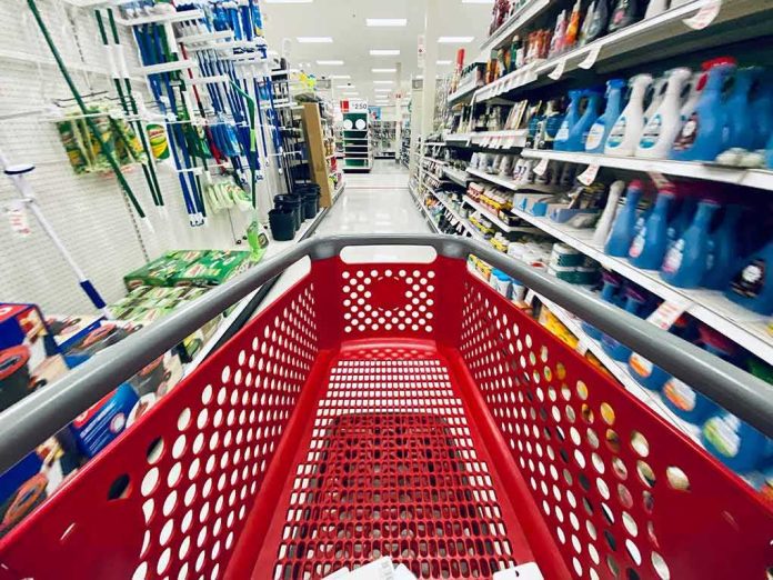 shutterstock_1569716605 red shopping cart in a supermarket aisle