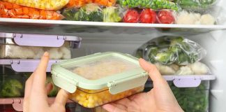RECALL: More Frozen Berries Added. The Bag May Be In YOUR Freezer Hands placing a food container in a freezer