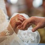 Serial Bride FLEECED 9 Men — Judge Fears She’ll Do It AGAIN Bride placing ring on groom's finger
