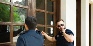Deadly Warrant Arrest – What TRAGEDY Officers Found Inside Two police officers check a wooden door with glass panels