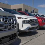 Almost a MILLION Dollars For a CHEVY?! Row of SUVs parked at a dealership lot