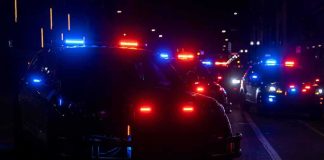 Gunfire Into FAMILIES — And What Police Say Sparked It Police vehicles with flashing red and blue lights at night