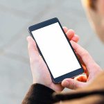 Accused Of A SICK 2-Year Plot, He Texted The WRONG Guy Person holding smartphone with blank white screen