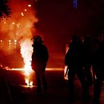 RECALL: Machine Catches FIRE From Something ORDINARY Riot police in silhouette amid smoke and fire at night
