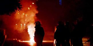 RECALL: Machine Catches FIRE From Something ORDINARY Riot police in silhouette amid smoke and fire at night
