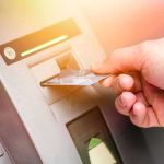 ATMs In 47 States Poured Out CASH — Who It Was FOR Is Far Worse Hand inserting bank card into ATM slot