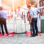 Gunman Pulled The Trigger. Then FATE Stepped In Security officers screen people at walk-through metal detectors