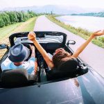 Supreme Court Order HITS Gun Owners Couple in a convertible driving along a lakeside road